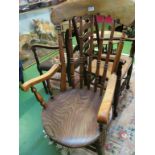 A 19th Century elm seated kitchen chair on turned supports