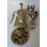 A brass inkwell with serpent to lid, a brass blotter, brass chamber stick and other brass