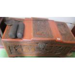 An Oriental carved camphor chest