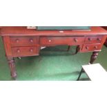 A William IV mahogany desk of five drawers on fluted supports
