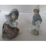 Two Lladro figures boy and girl both with sheep