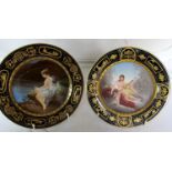 A pair of late 19th Century Vienna plates 'Venus and Amor' and 'Psyche' with blue and gilt borders
