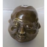 Four face metal Buddha heads.