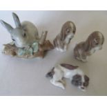 A Lladro rabbit and three small Lladro dogs