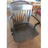 A swivel captains style desk chair