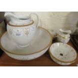 A Wedgwood wash bowl and ewer set with gilt wreath and floral design