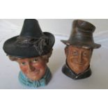 Two German pottery jars in the form of a man and lady with hats as lids