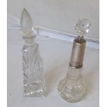 A silver top scent bottle and another tall one