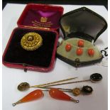 A cased set of coral studs, cased Victorian gold brooch, pair of cornelian earrings and four tie