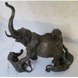 A bronze group lions attacking elephant