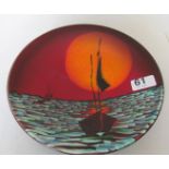 An Anti Harris plate sailing boat in sunset, boxed