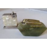 A mother of pearl clad lighter and onyx lighter