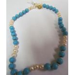 A pearl and turquoise necklace