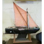A model sailing boat on stand