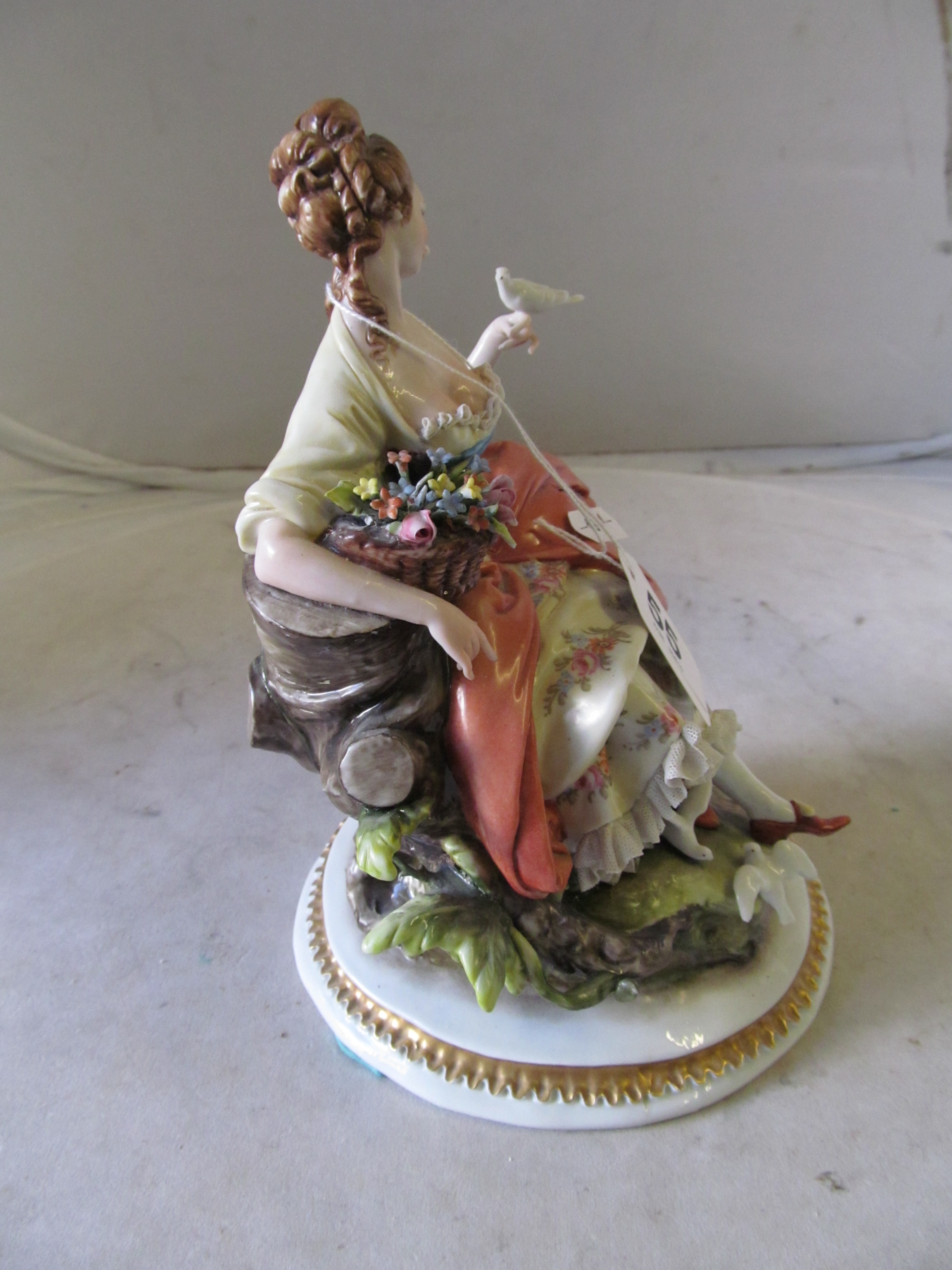 A Capodimonte figure lady with basket of flowers holding a dove - Image 4 of 22