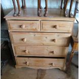 A pine chest of 2 short and 3 long drawers