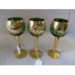 A set of five Venetian coloured glass and gilt floral pattern drinking glasses