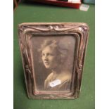A silver photograph frame and another