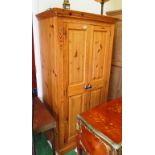 A pine double wardrobe with blue handles