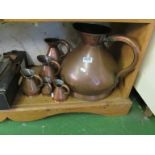 A set of 19th Century copper measuring jugs.