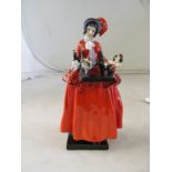 A rare Royal Doulton figure 'The Toy seller' lady in red dress with tray of toys (sa/f)