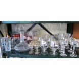 Two glass decanters and various drinking glasses
