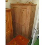 A pine double wardrobe with drawer
