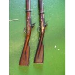 A pair of ornamental replica guns.