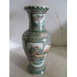 A 19th Century famille verte vase with scenes of dignitaries and Samurai in interior settings.