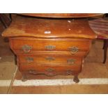 A small oak bombe fronted three drawer chest