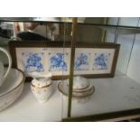 A Wedgwood wash bowl and ewer set with gilt wreath and floral design (sa/f) and four framed tiles (