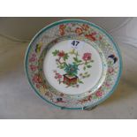A Worcester Royal Porcelain works plate decorated flower arrangement within butterfly border