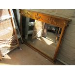 A gilt overmantel mirror