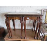 A nest of three walnut occasional tables