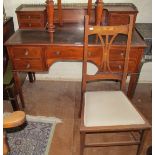 An Edwardian mahogany and satinwood banded ladies writing desk with gallery top and drawers on
