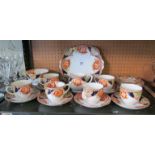 A bone china Imari pattern teaset six place setting with bread and butter plate, sugar bowl and jug