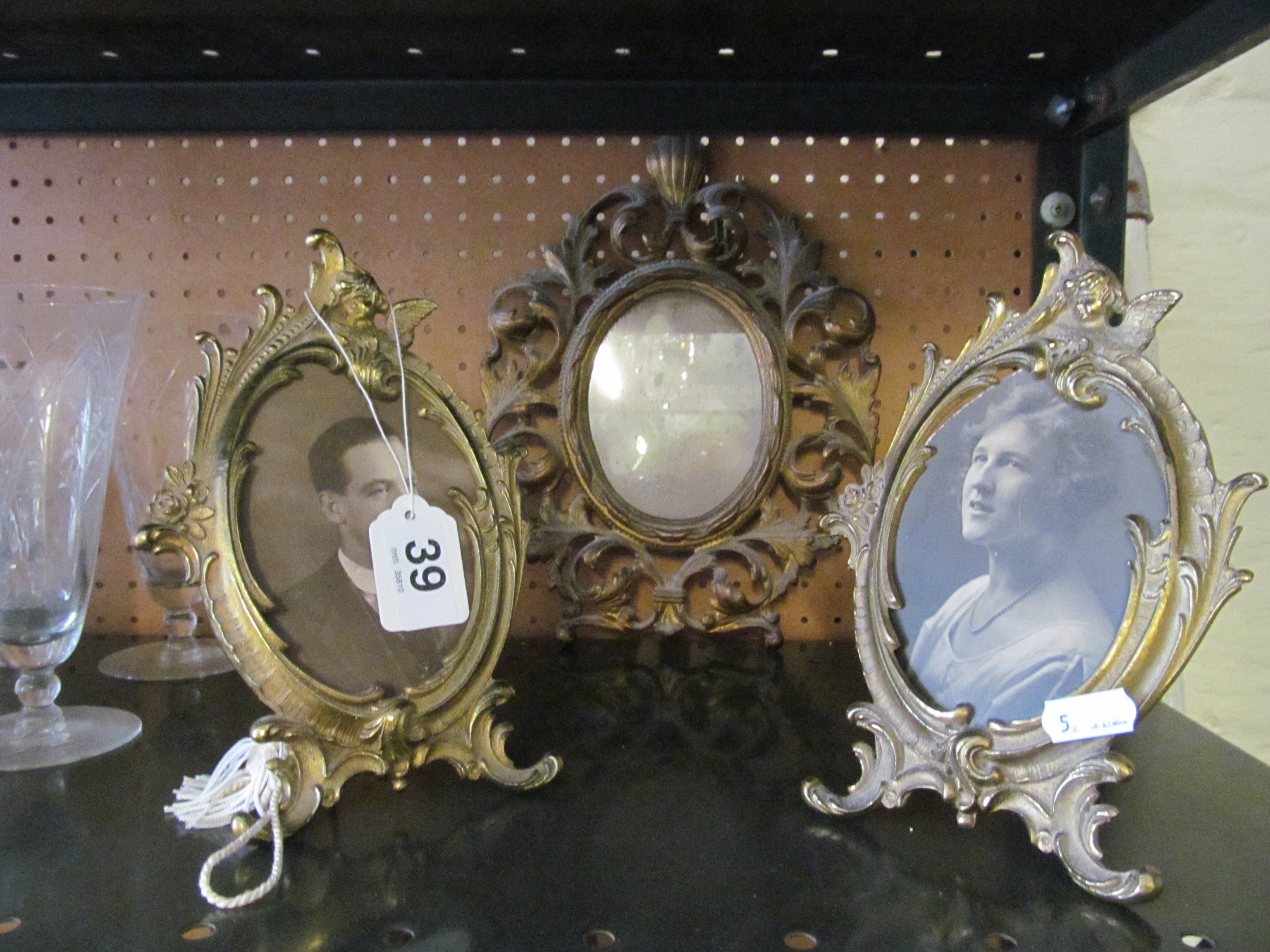 Three brass photograph frames