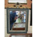 A small green and cream framed mirror and a print sampler
