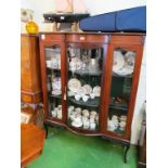 An Edwardian display cabinet with central bowfronted glass door on cabriole legs