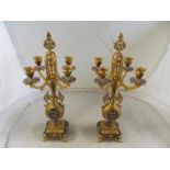 A pair of 19th Century four branch ormulu and champleve enamel candlesticks