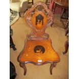 A Victorian Black Forest walnut chair with oak leaf oval back inlaid panel of goats and goatherd,