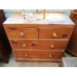 A small pine chest of two short and two long drawers