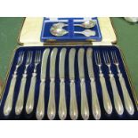 Two silver commemorative spoons (boxed) and a set of six silver handled dessert knives and forks (