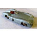 A 1950's tinplate German made Mercedes Silver Arrow racing car (10 1/2 inches long)