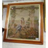 A tapestry of an 18th Century man climbing on a wall in burr walnut frame.