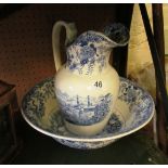 A blue and white wash jug and bowl river and town scene