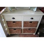 A cream sideboard with two drawers and four baskets under