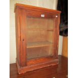 A small pitch pine glass fronted cabinet