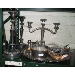 A silver plated circular salver, plated candlesticks and other plated items.