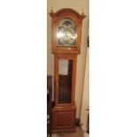 A Grandmother Clock 8 day Westminster chime movement in cherrywood case